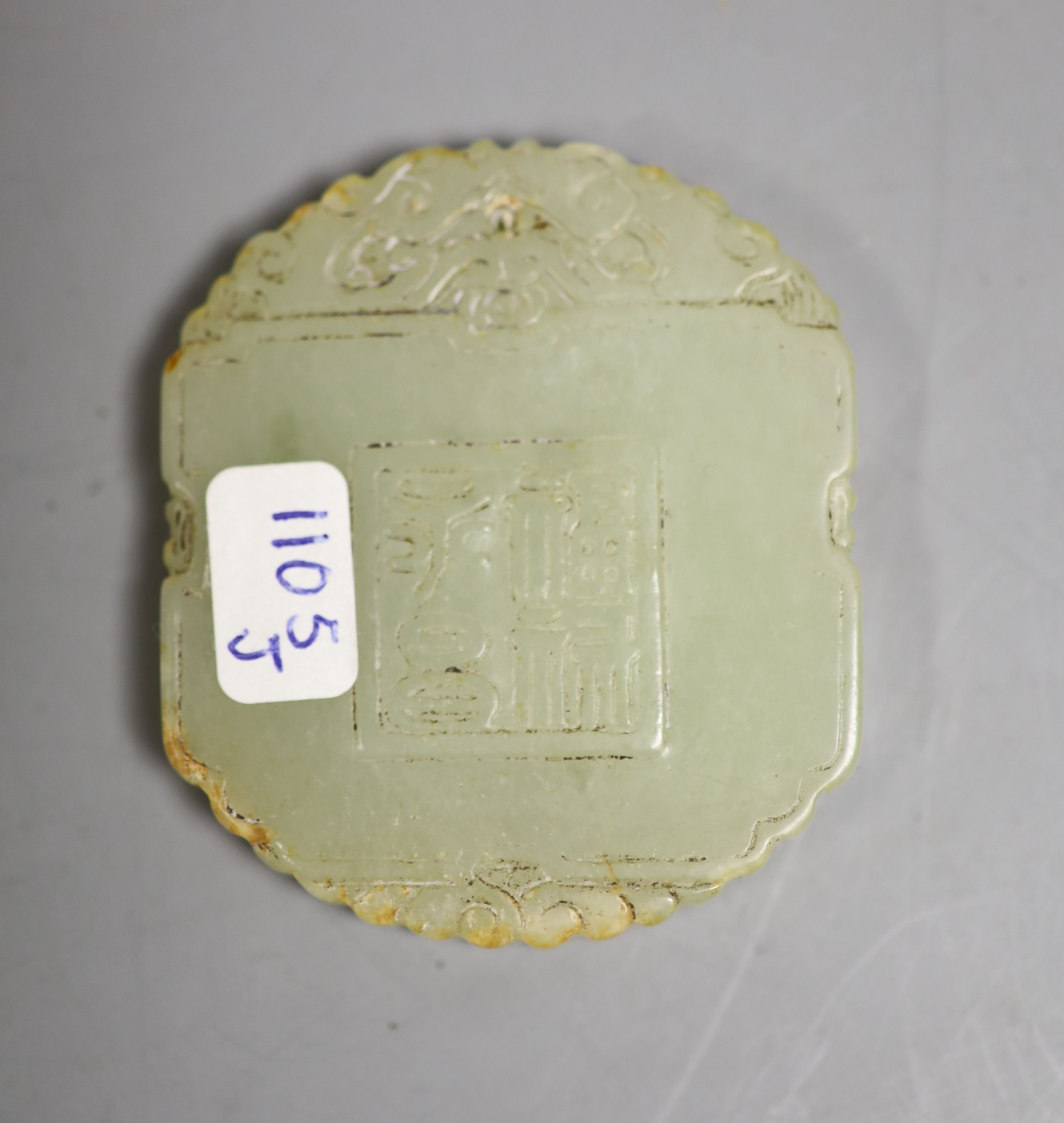 A Chinese pale celadon jade plaque, boy and bats, 5cm wide